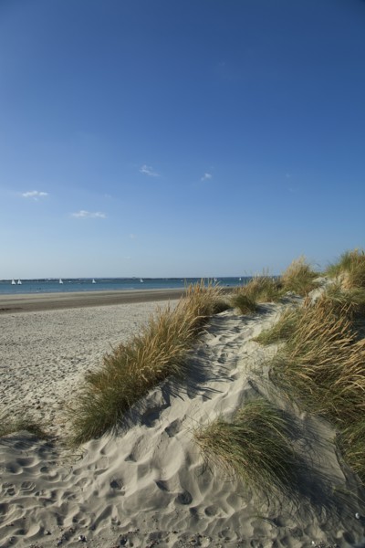 East Head Sand dunes and beach with sunshine and blue sky