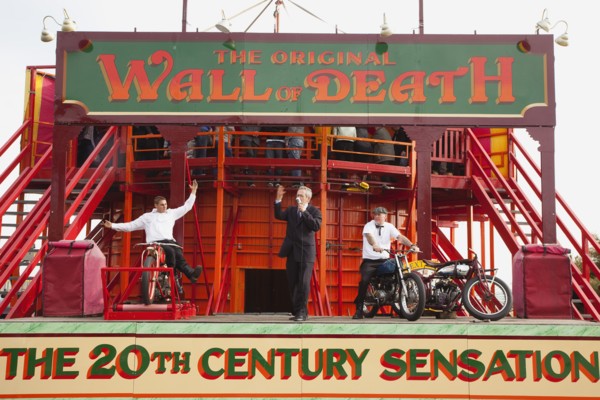 Wall of death motorcycle fairground attraction on Madeira Drive during motorbike festival.