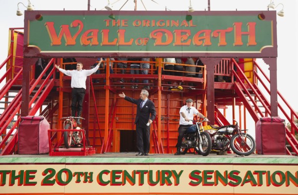 Wall of death motorcycle fairground attraction on Madeira Drive during motorbike festival.