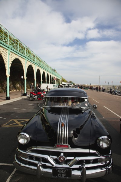Old American Pontiac automobile on Madeira Drive during classic car festival.