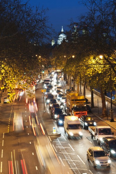 Rush hour traffic along the Embankment with St Paul's Cathedral in the background.
