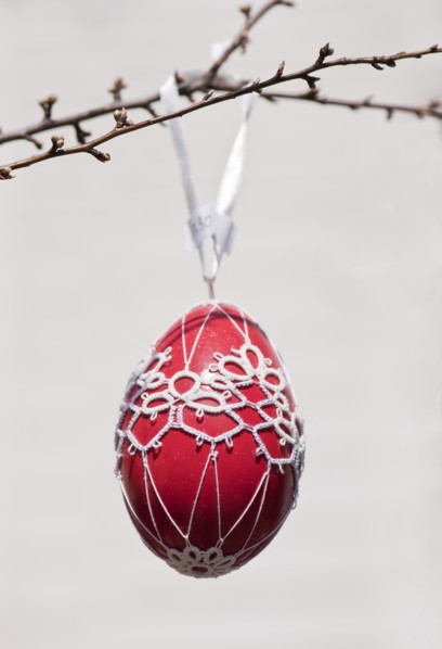 Hand-painted egg shell hanging from a branch to celebrate Easter at the Old Vienna Easter Market at the Freyung.