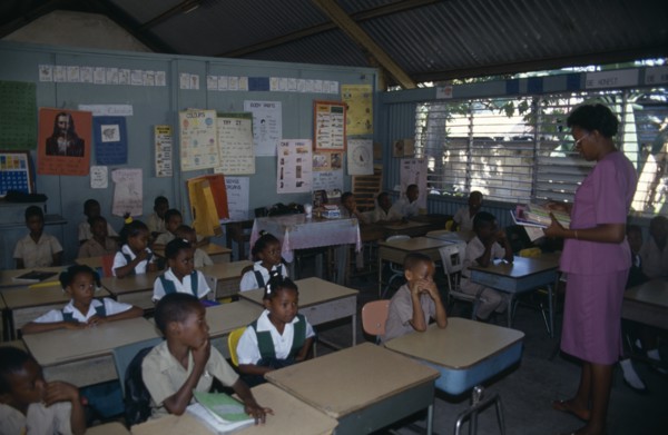 West Indies, Jamaica, Falmouth, First Grade pupils in classroom with female teacher. Photo : Nancy