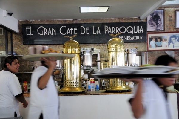 Mexico, Veracruz, Cafe El Gran Cafe de la Parroquia interior with waiters carrying laden trays past