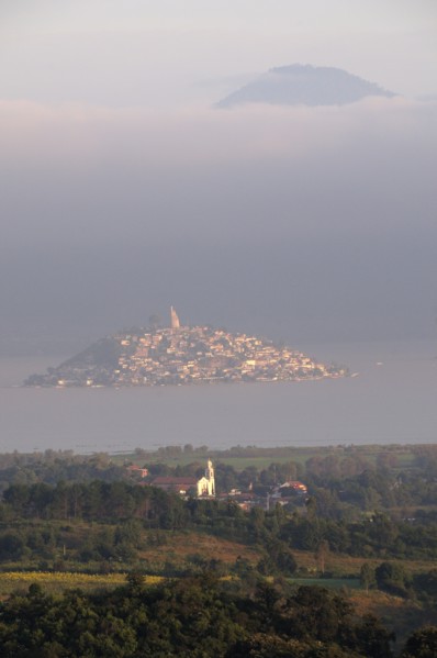Mexico, Michoacan, Patzcuaro, Early morning misty view of Lago Patzcuaro with Isla Janitzio. Photo
