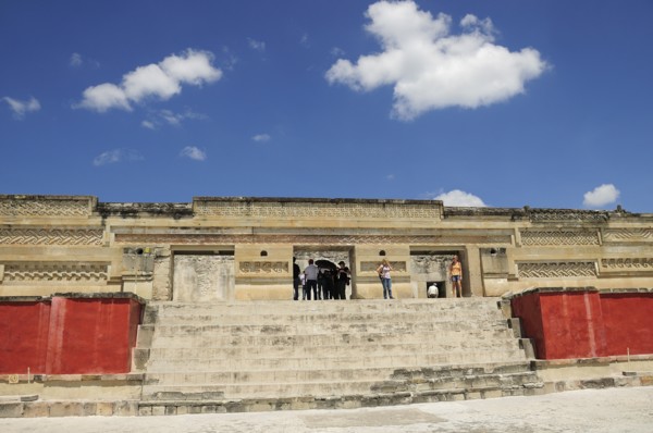 Mexico, Oaxaca, Mitla, Archaeological site Templo de las Columnas with tourist visitors standing at