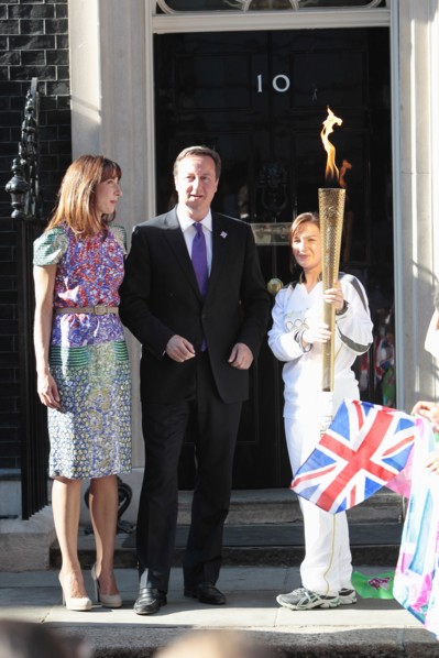 England, London, Olympic Torch relay in Downing Street Samantha and Prime Minister David Cameron