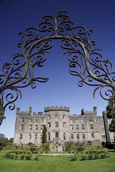 Ireland, County Sligo, Markree, Castle hotel castle and garden viewed through ornamental iron