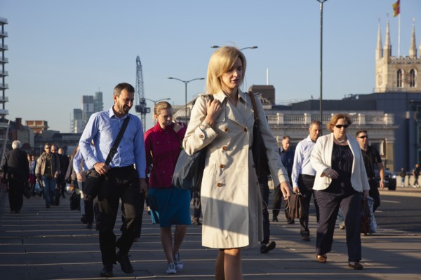 England, London, Early morning commuters crossing London Bridge towards the City Financial district