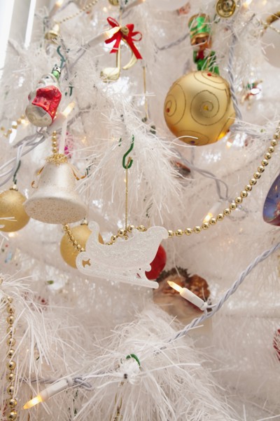 Festivals, Religious, Christmas, Detail of tree decorated with lights tinsel and various baubles.