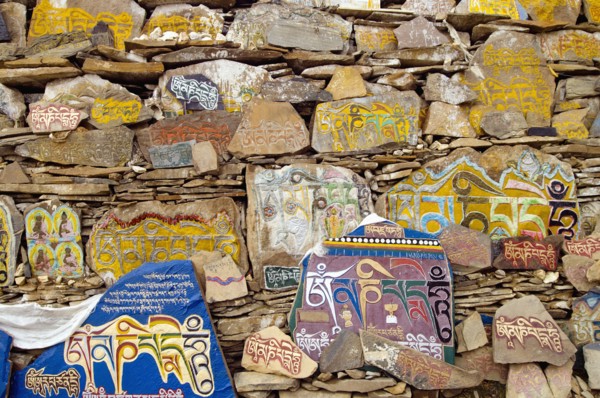 China, Szechuan Province, Tibet, Litang county Mani stone wall outside Litang Buddhist Monastery in