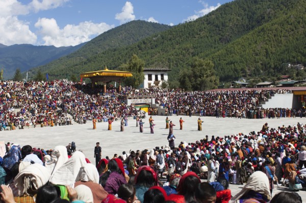 Bhutan, Thimpu Dzong, Dancers in the courtyard during festival. 
Photo Nic I'Anson