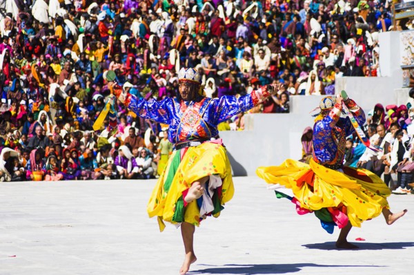 Bhutan, Thimphu Dzong, Dancers in traditional Buddhist costume for the Tsecchu, or Masked Dance. .