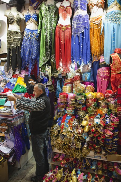 Turkey, Istanbul, Fatih, Sultanahmet, Kapalicarsi, Stall selling traditional clothing in the Grand