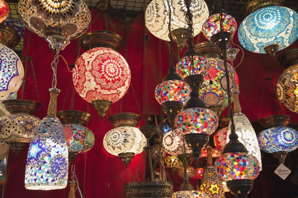 Turkey, Istanbul, Fatih, Sultanahmet, Kapalicarsi, Display of ornate coloured glass lamps in the
