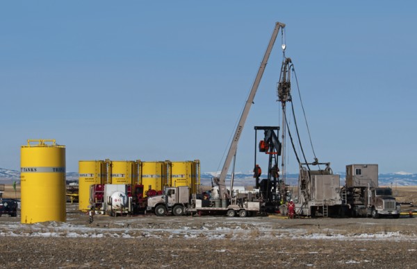 Canada, Alberta, Granum, Argosy Energy Inc fracking for tight shale oil in a wheat field at the