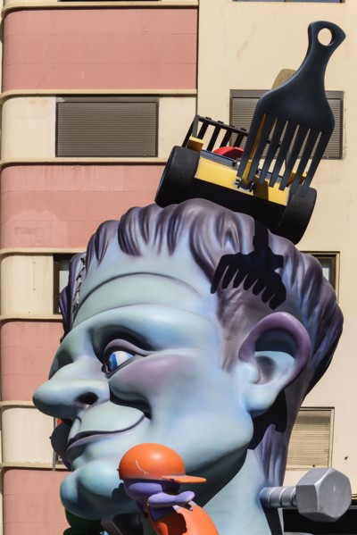 Spain, Valencia Province, Valencia, Papier Mache figure in the street during Las Fallas festival,