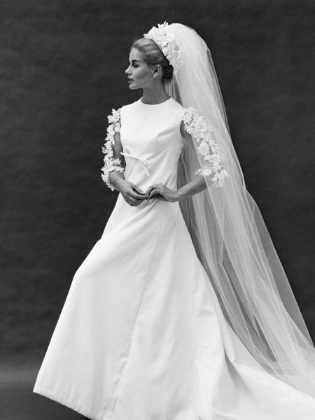 Bride in a wedding dress with a train and veil, photo John French. London, England, 20th century.
