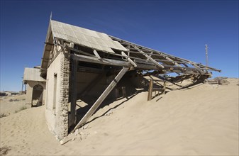 Old house overtaken with sand
\n