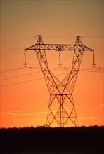 Electicity pylon at sunset