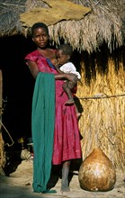 LOZI WOMAN FEEDING CHILD, WESTERN ZAMBIA, ZAMBIA