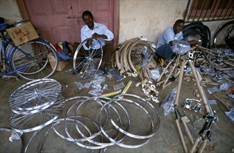 MAN REPAIRING BICYCLES, MALAWI
