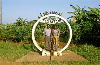 TWO LOCALS AT UGANDAN EQUATOR MONUMENT, UGANDA