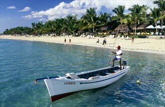 BOAT AND BEACH AT LA PIROGUE, SEEN FROM THE WATER, MAURITIUS