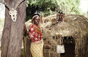 SAMBURU WOMAN AND HUT, SERENA, KENYA