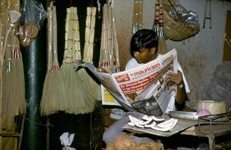 MAN WITH LOCAL NEWSPAPER, MAURITIUS