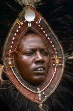 MAASAI WARRIOR WITH OSTRICH HEADDRESS, MARA, KENYA