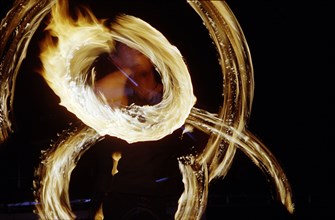 A fire dancer gets into the zone during a performance at the Cindi "Celebration of Light" at the