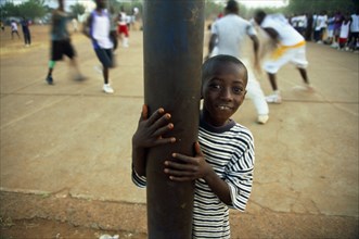 In the suburb of Corofina Nord, Bamako, Mali, young people gather in the late afternoon at a large