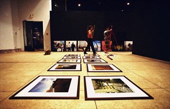 Setting up photographic exhibition at the National Museum before the launch of the 6th African