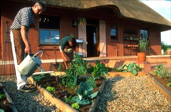 landscape view of the managers tending the garden