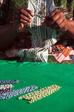 Umtha Beads, Cape Town, South Africa 06/1997
A Xhosa speaking worker creates a necklace from beads
