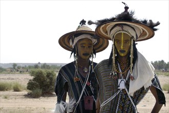 Wodaabe men prepare to perform a dance of male beauty at a festival in InGall, near Agadez in Niger
