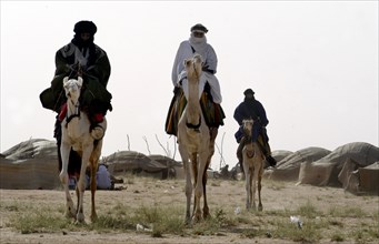 Nomads are seen on camels at the Salt Cure festival drawing nomads from all over the region to
