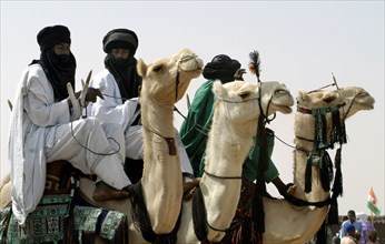 Nomads are seen on camels at the Salt Cure festival drawing nomads from all over the region to