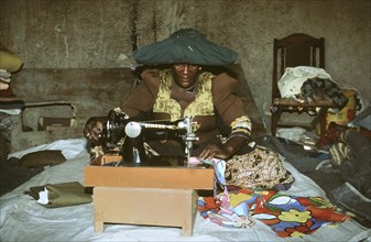 Herero woman sewing