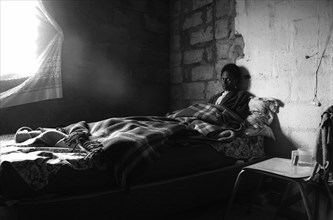 A young woman sick in bed
