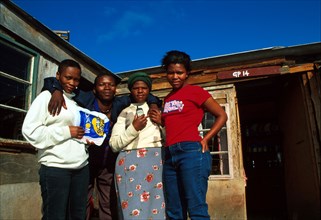 Residents of Silahliwe pose for the camera outside one of their shacks. Ukuthasa worked hard to get