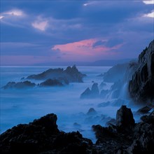 THE ROCKY SHORE ALONG THE OTTER TRAIL