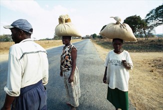 Johannes Moses (right) walked 10km with Trinis and Tabetha Alick to a neighbouring farm, where they bought the bags of grain from workers who had swept it off the threshing floor. All they had had for...
