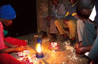Members of the Edfri famine relief team prepare supper - from left to right Solomon Gitonga, Joseph Macharia, John Mburi, Al Maingi, and Dominic Ikiara