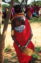 A Samburu child on his mother