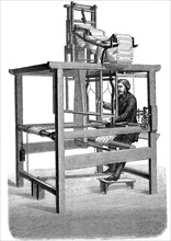 Jacquard loom, with swags of punched cards from which pattern was woven