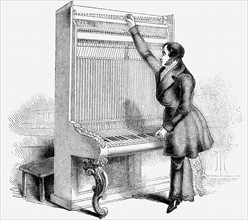 Engraving showning a man tuning a Broadwood Cabinet piano