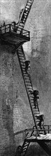 Gravure représentant des femmes montant  une échelle pour porter le charbon en haut du puits de mine. Ecosse, déut du 19e siècle