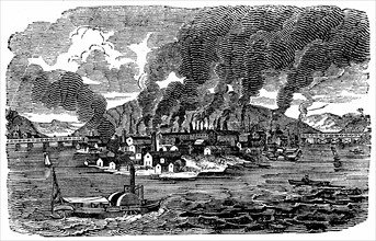 Vue d'ensemble de la ville de Pittsburgh, en pennsylvanie montrant les fumees s'echappant des nombreuses fonderies et des laminoirs